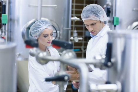 Biologist_team_talking_and_wearing_hairnet_in_the_factory